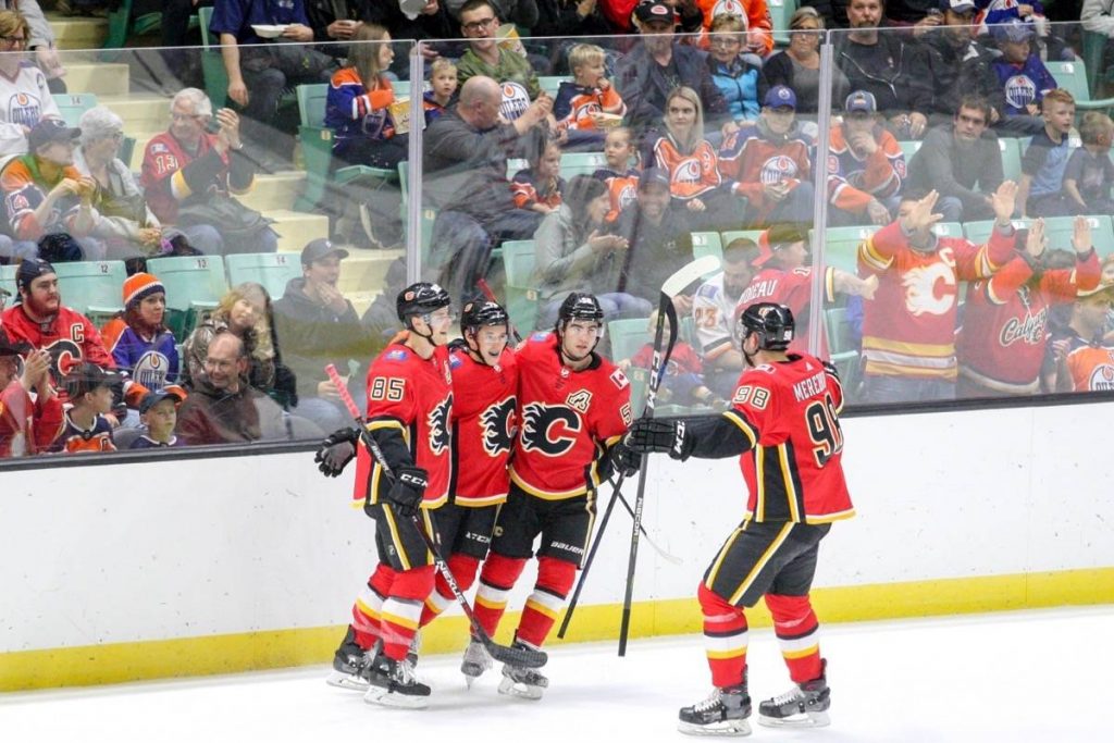 A group of hockey players posing for a picture