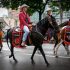 A group of people riding on the back of a horse